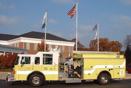 Fire Truck In Front of Flags
